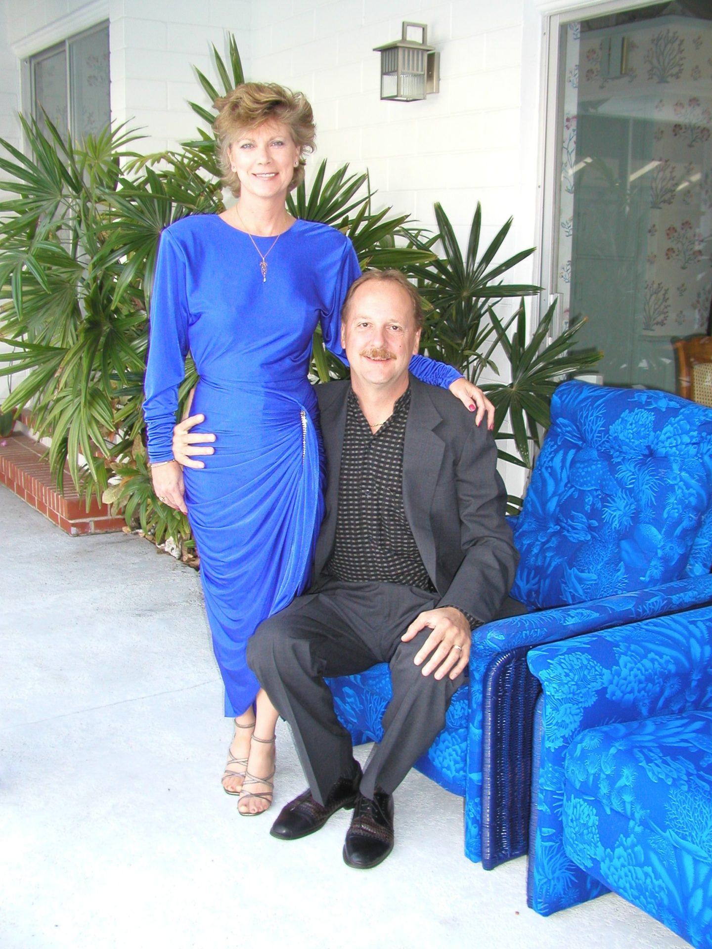 Glamorous Priscilla and her handsome love, Taylor. All dressed up for a special event, posing near the swimming pool.
