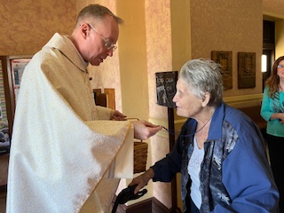 Rosemary blessed by Pastor Father Ken