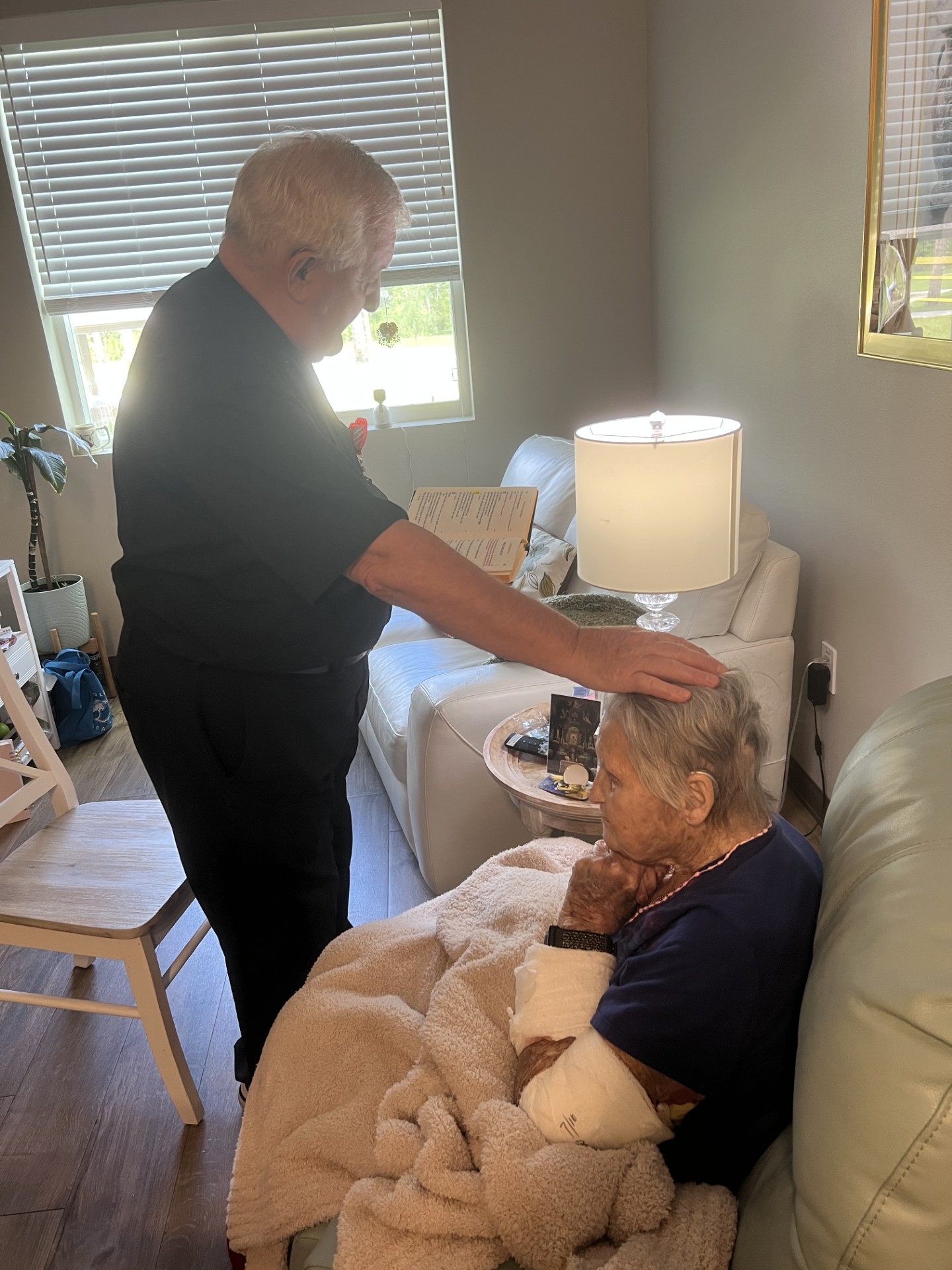 Rosemary blessed by Father Ted