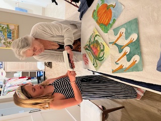 Rosemary mentoring great granddaughter on painting techniques