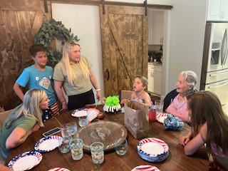 Rosemary with grandchildren and great grandchildren - game night at the Millers