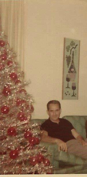 Uncle Vince, 1967 in his home beside his beautiful white Christmas tree.