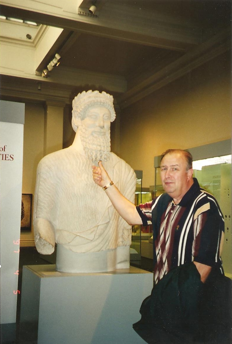 Daddy tweaking the beard of some ancient ruler's statue in the British Museum. He loved nothing better than teasing people or playing some kind of prank, all the way from a fellow co-worker right up to a king.