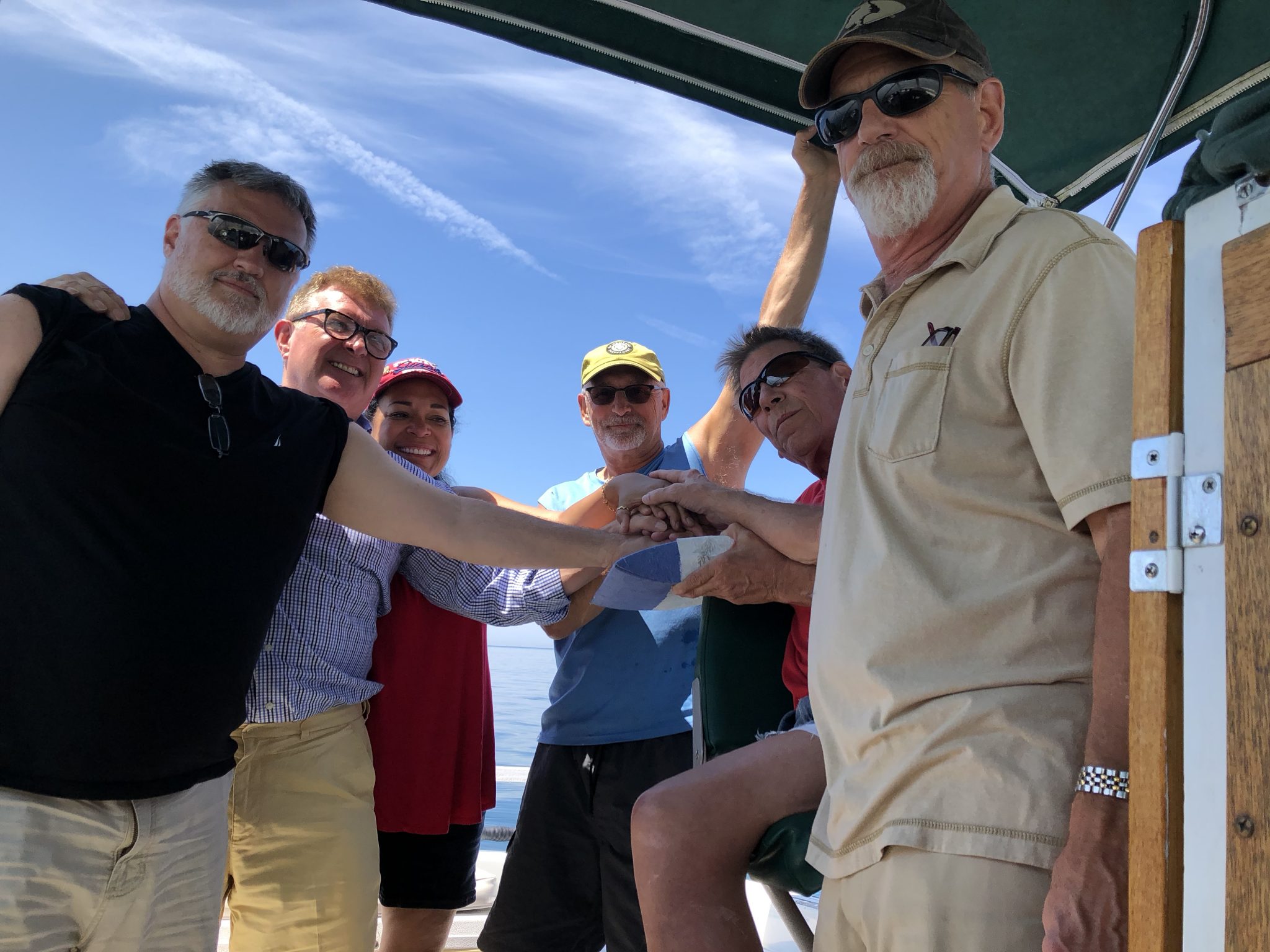 Gathering to celebrate CK at city beach Grand Haven Michigan