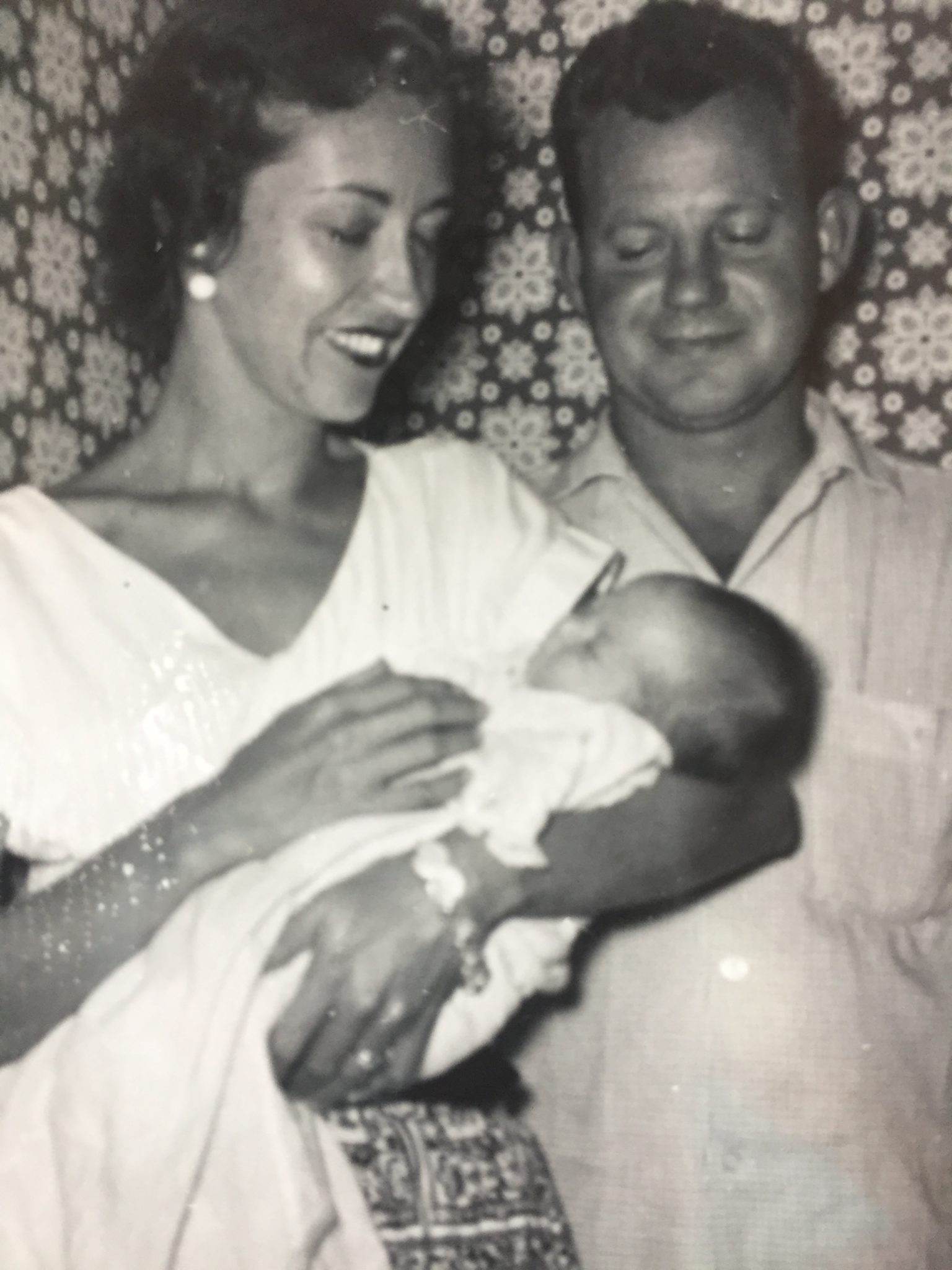 Steve and Mary Carmichael, holding their newly baptized godchild, Holly.