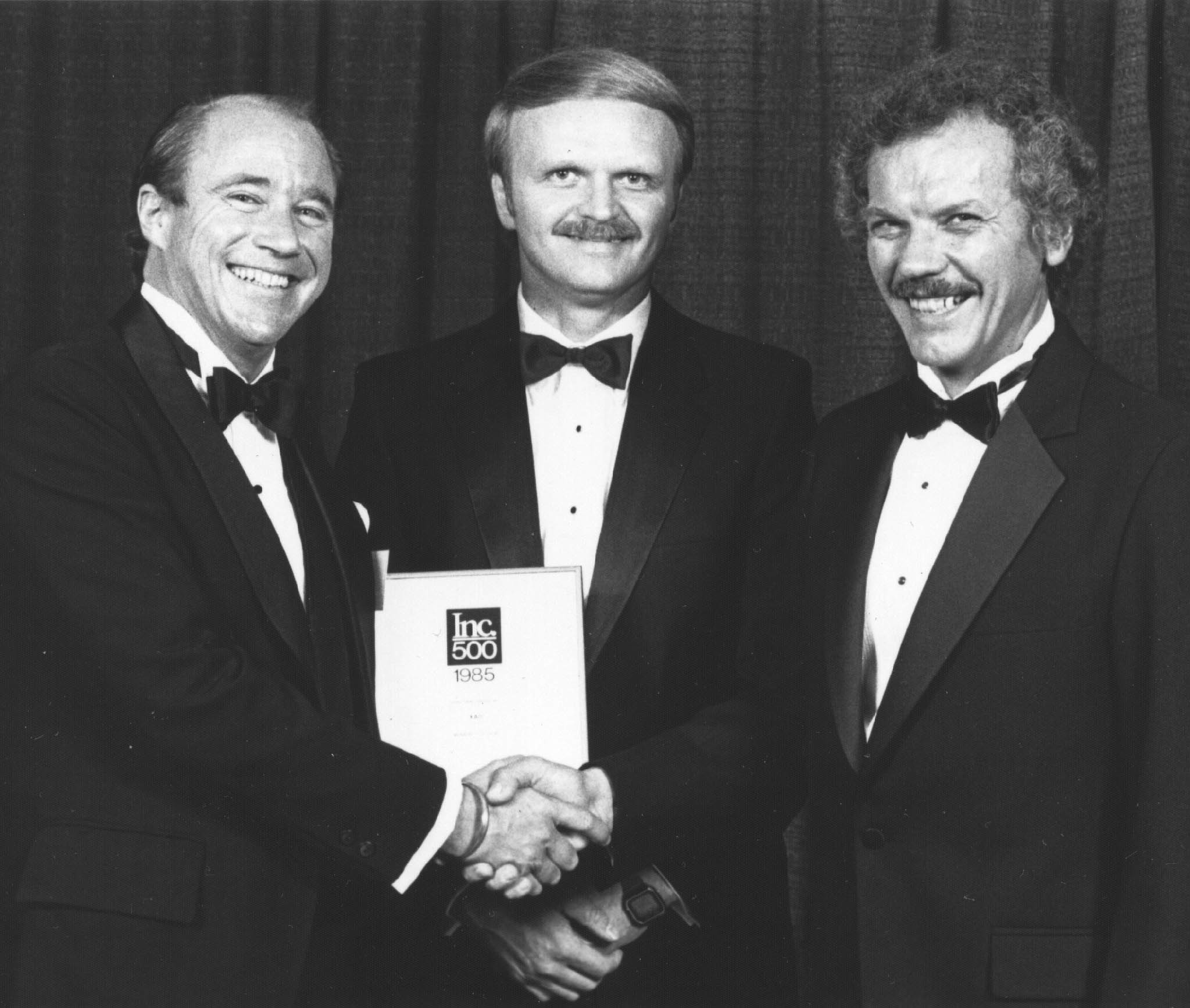 Bob and Heinz accepting the INC 500 award, 1986