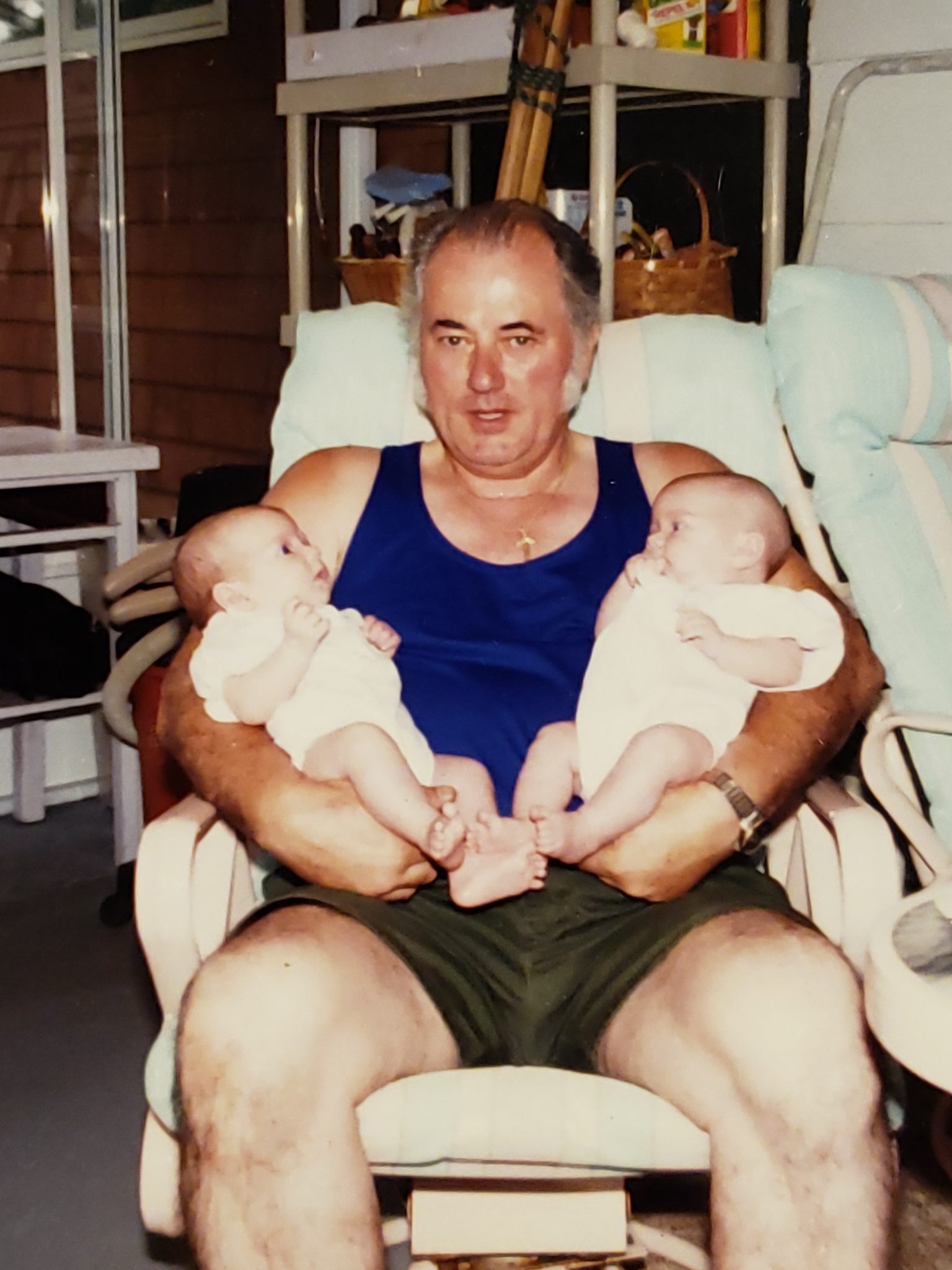 Dad with his twin granddaughters
