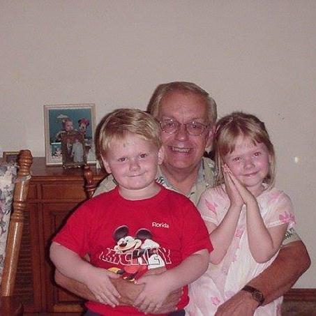 Greg with his two grand children