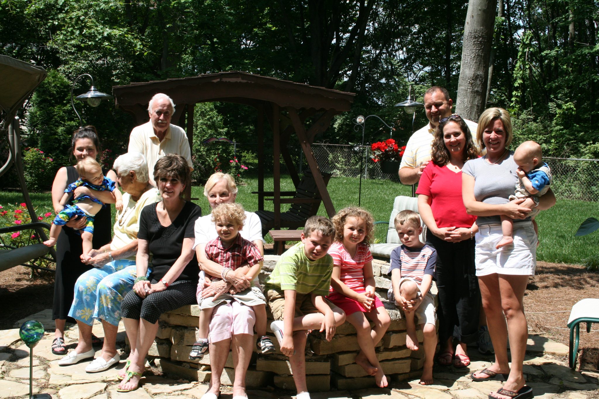This is Aunt Pat with (from left to right) Alecia Simmons holding Mason Simmons, Pat, Bud, my mom, Aunt Mona holding Christian Simmons (David's son), Elliot Delape (Becky's son), Lexy Simmons (David's daughter), Hunter Delape (Becky's son), David Simmons, Shelly Simmons (David's wife), Becky Simmons holding Sean Simmons (David's son) in June of 2008.