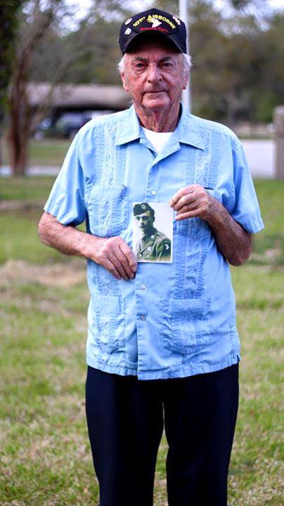 Frenchy in 2016 living in Florida, holding a photo of himself as a soldier in WWII 1944