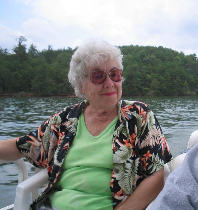 My mom will be dearly missed.  She was always happy when near the water, and she loved the mountains of North Carolina, so here's a photo of her enjoying both at Lake Lure.  Peace for you and your spirit, Mom.
