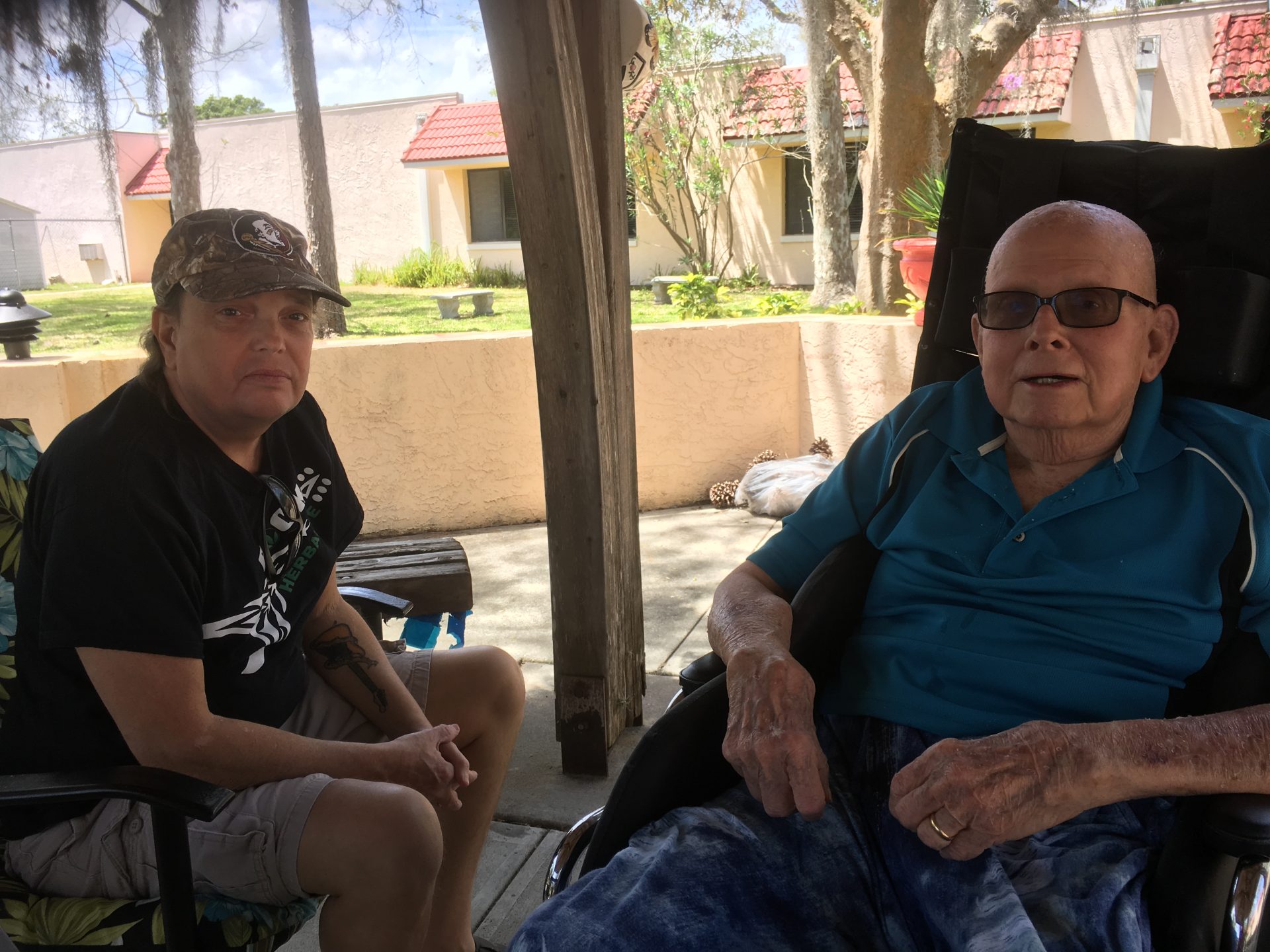 Bob explaining to Chuck how the leaves are different on each tree and how the change to a silverish when the wind hits them.  Bob loved the trees!