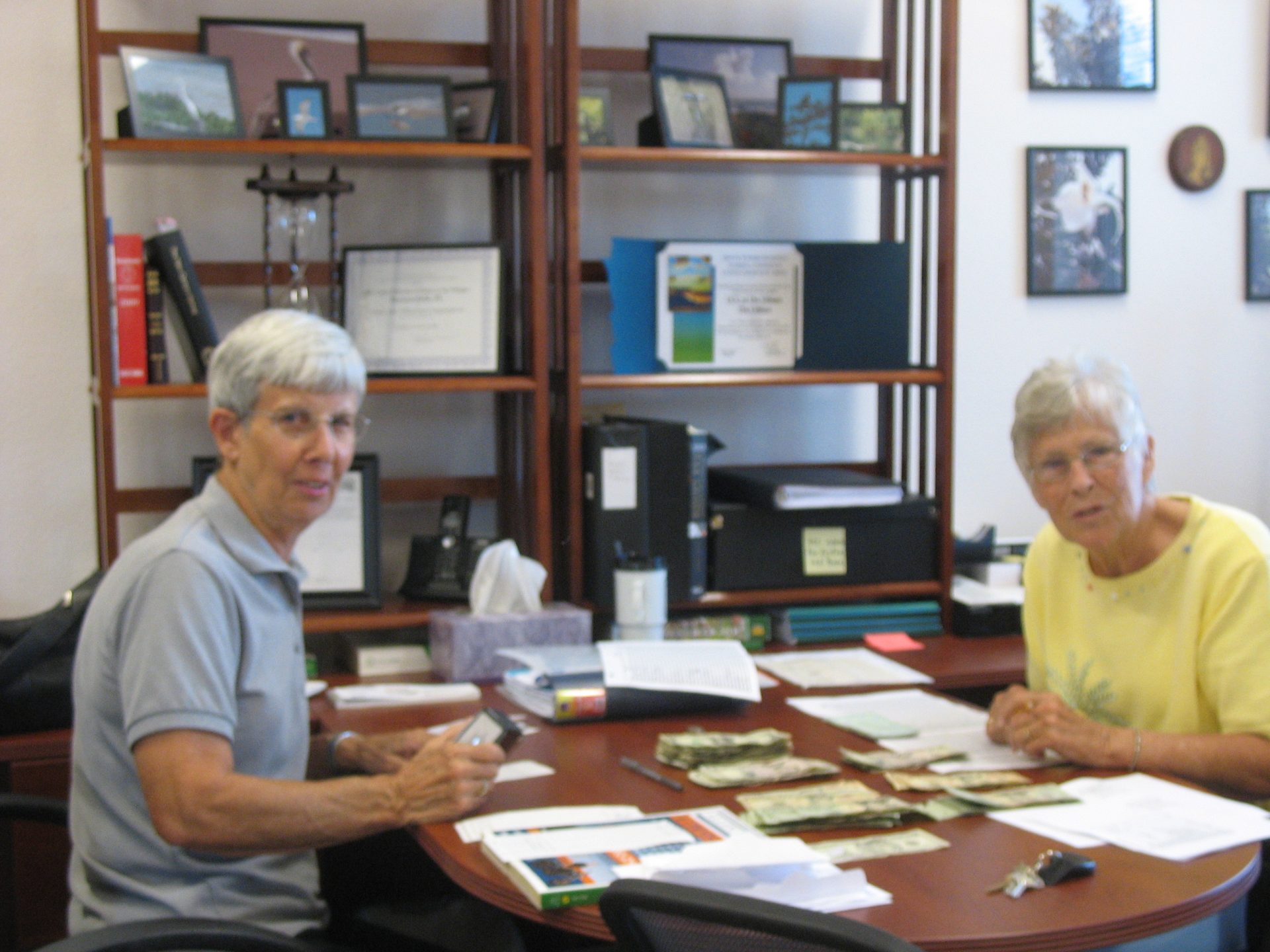Pat and Nancy working in the church office