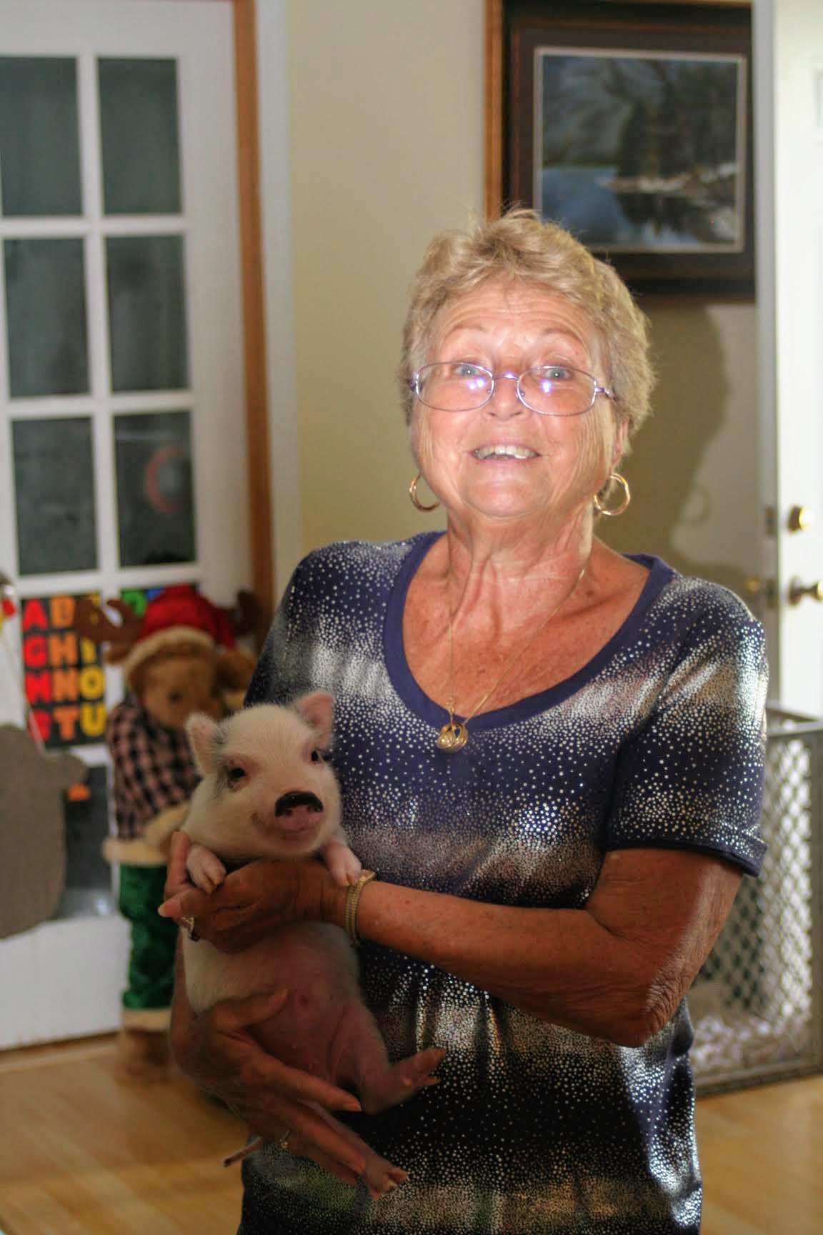 Mom holding a little piggy