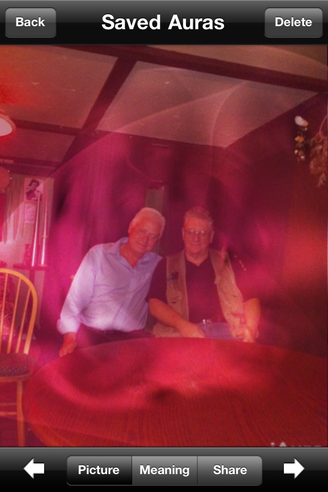 The favorite picture I’ve ever taken. this is with an old iPhone IAura app. They discontinued it when they kept upgrading the iPhones but it was a great app.  this is Victor and Dennis a medium from England who was pretty much the Better Homes & Gardens type of guy he would recommend mediums around the world so he came and sat with us and gave Victor his approval.   He put Victor in the magazine that he produced back there for sitters to find us ❤️  If you look closely at the picture you can see three masters. Kathumi is standing behind them in the cabinet you can see the jewel in his crown. And that’s just one reason we love to do séances xo