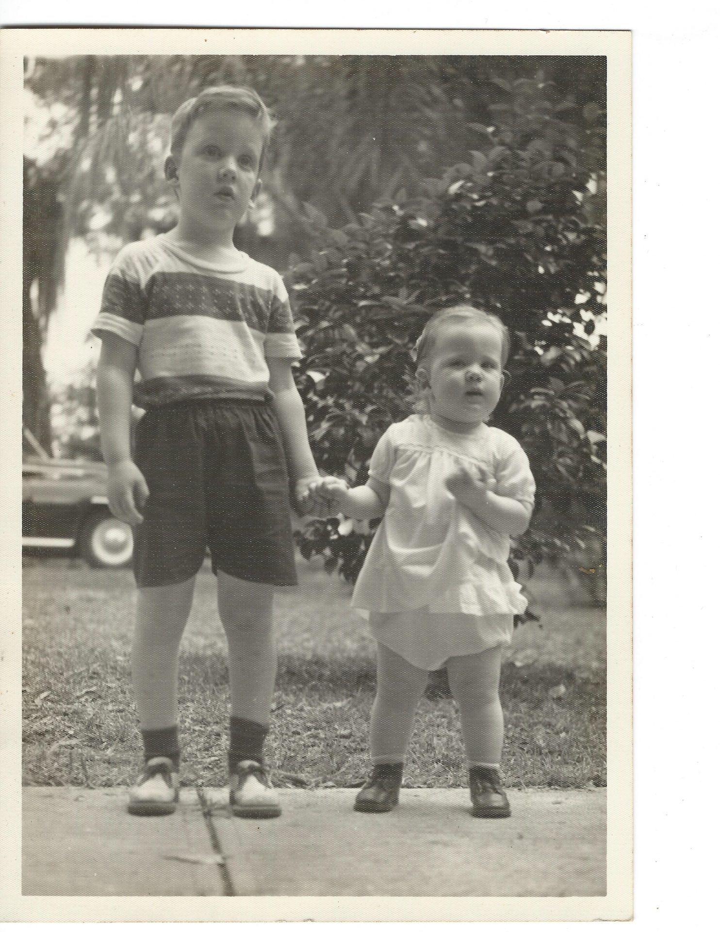 Victor and Valorie in grandmothers front yard in 1956 or so. Mother liked this picture.