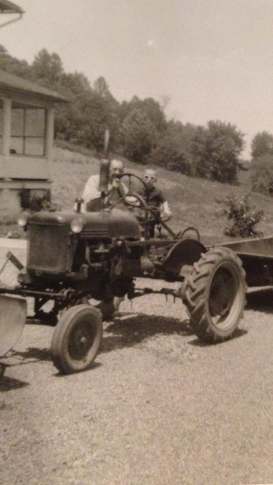 Victor as a baby sitting on the Tractor at grandfathers (Papa V) farm in Ohio.