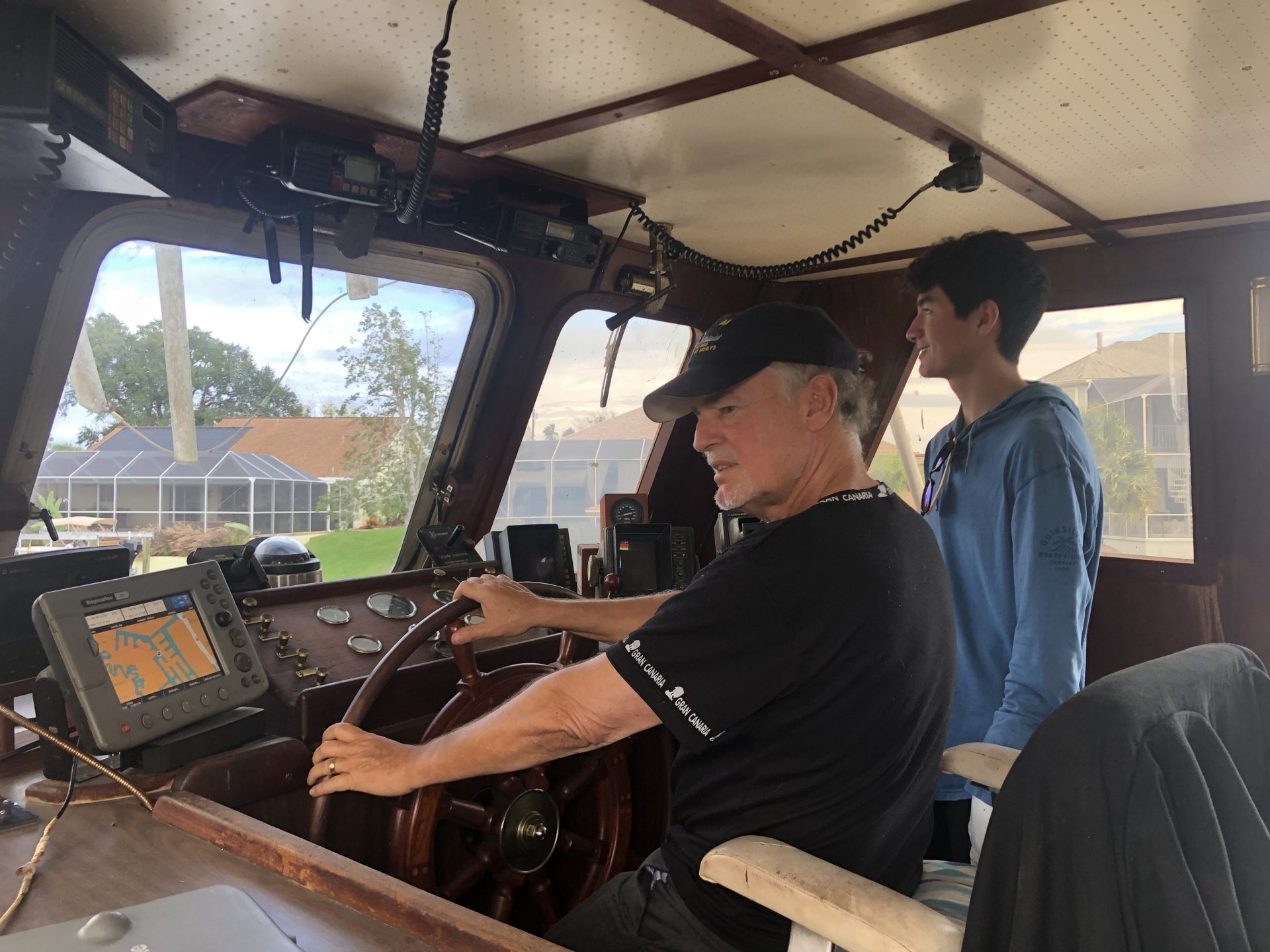 Tom and Corbin starting the Fung Shui's engine, lets have fun today boating...