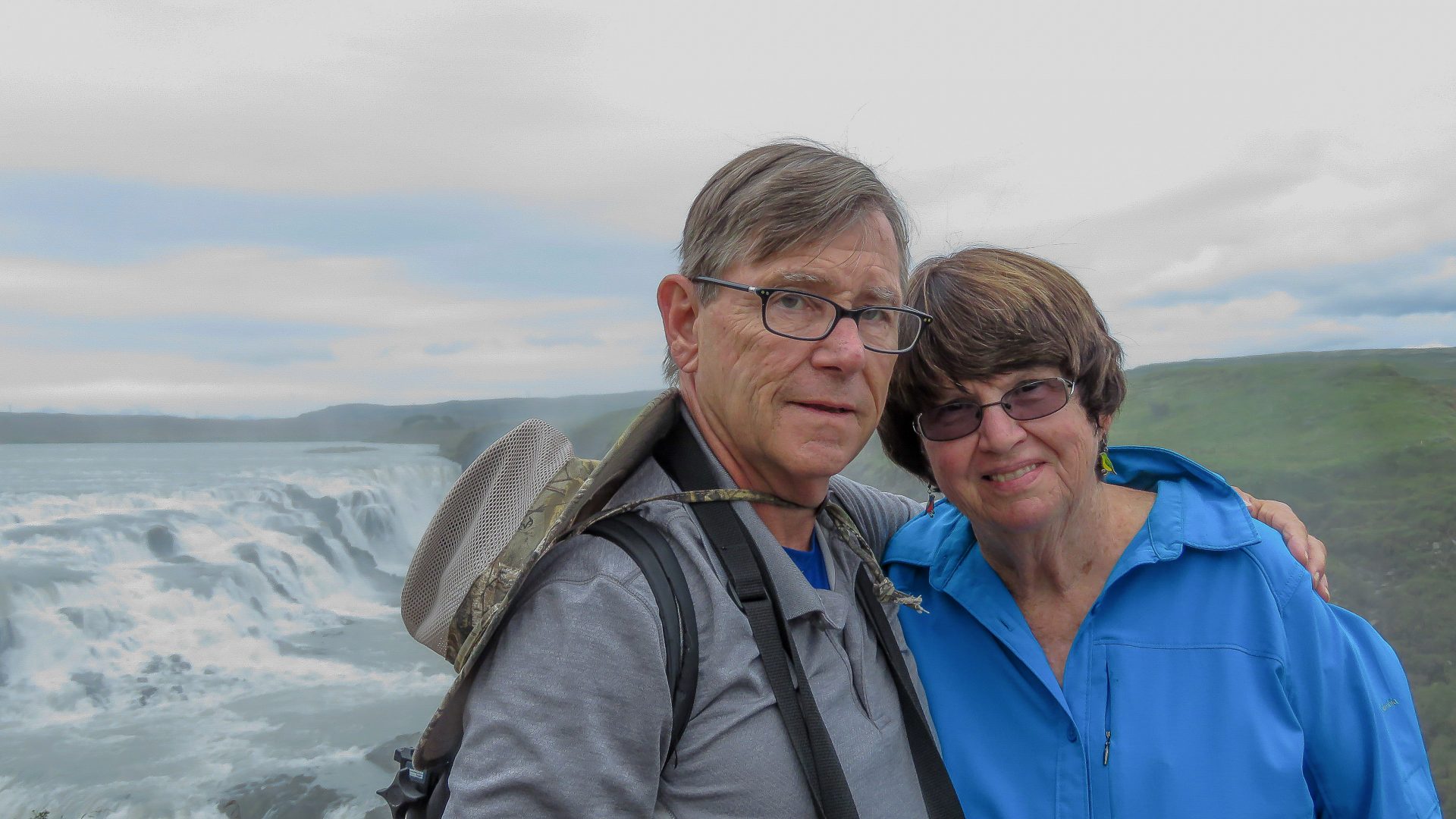 Don and Maureen in front of a large Icelandic waterfalls.