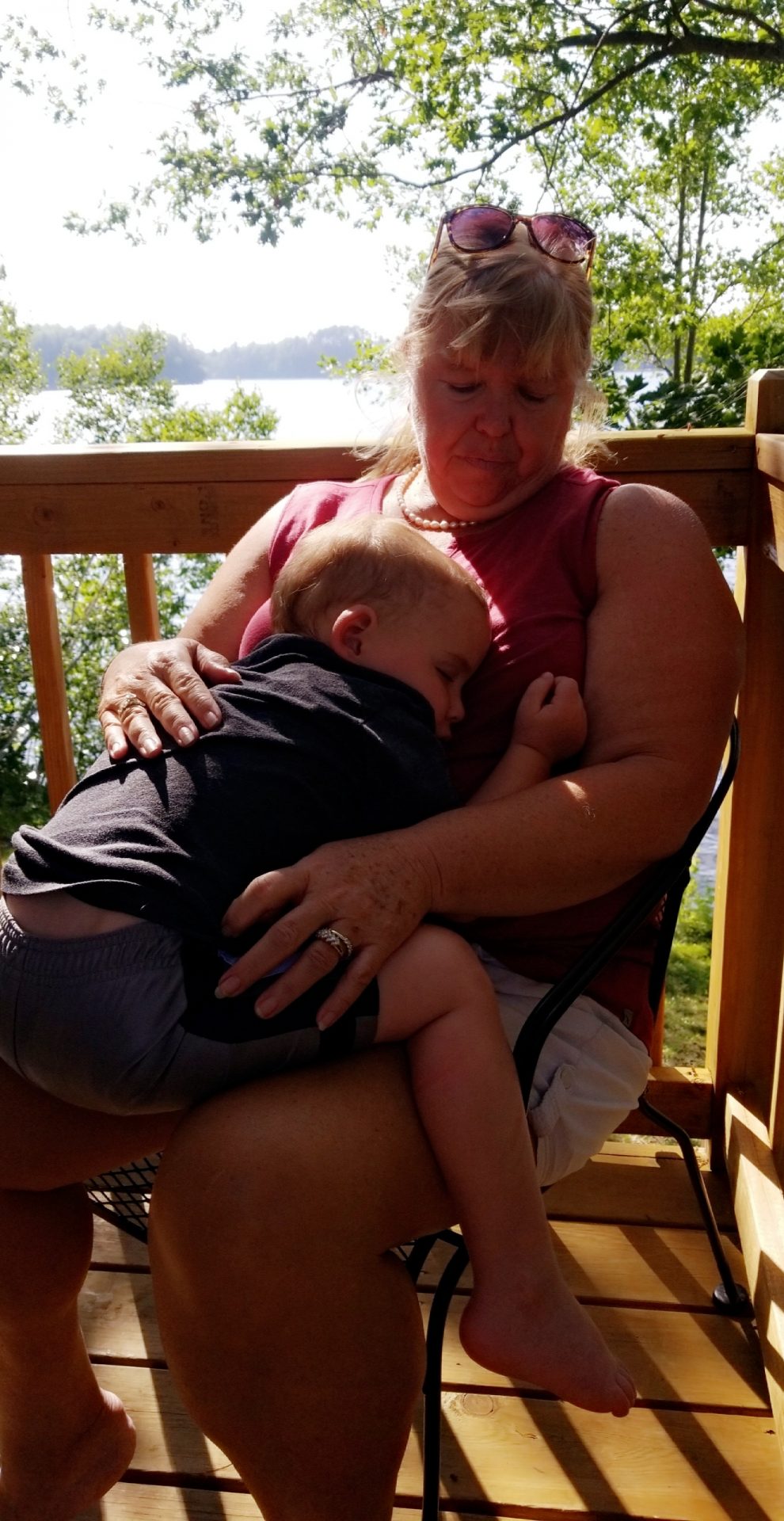 Holding her sleeping grandson