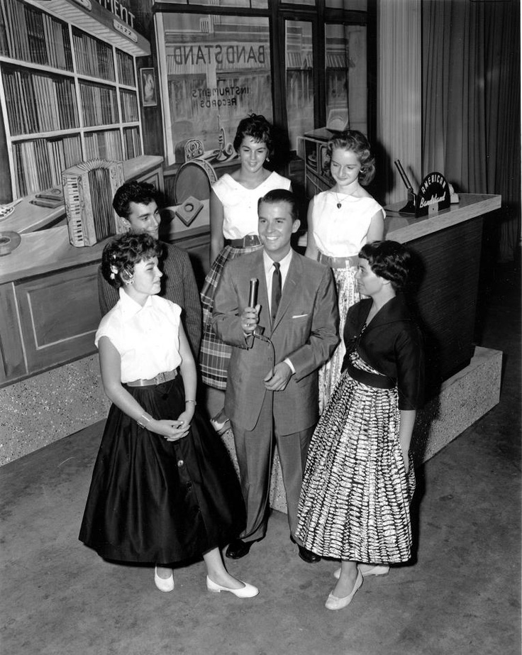 Barbara on American Bandstand standing behind Dick Clark.