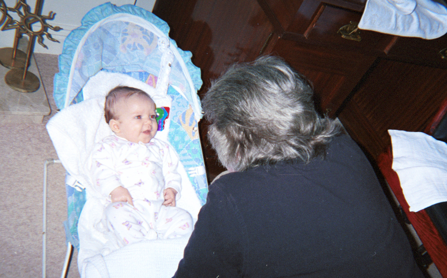 Grandma Mary Lou on first visit to meet first grandchild, Natalie. UK December 2000