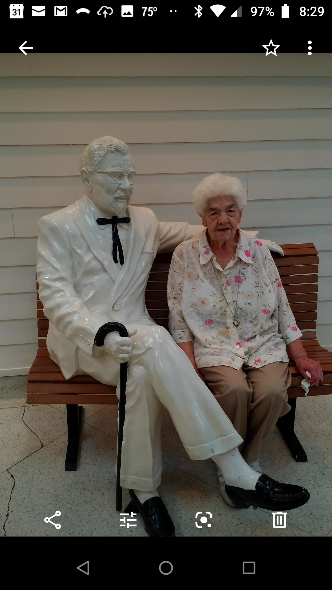Mom with Colonel Sanders on trip to Kentucky
