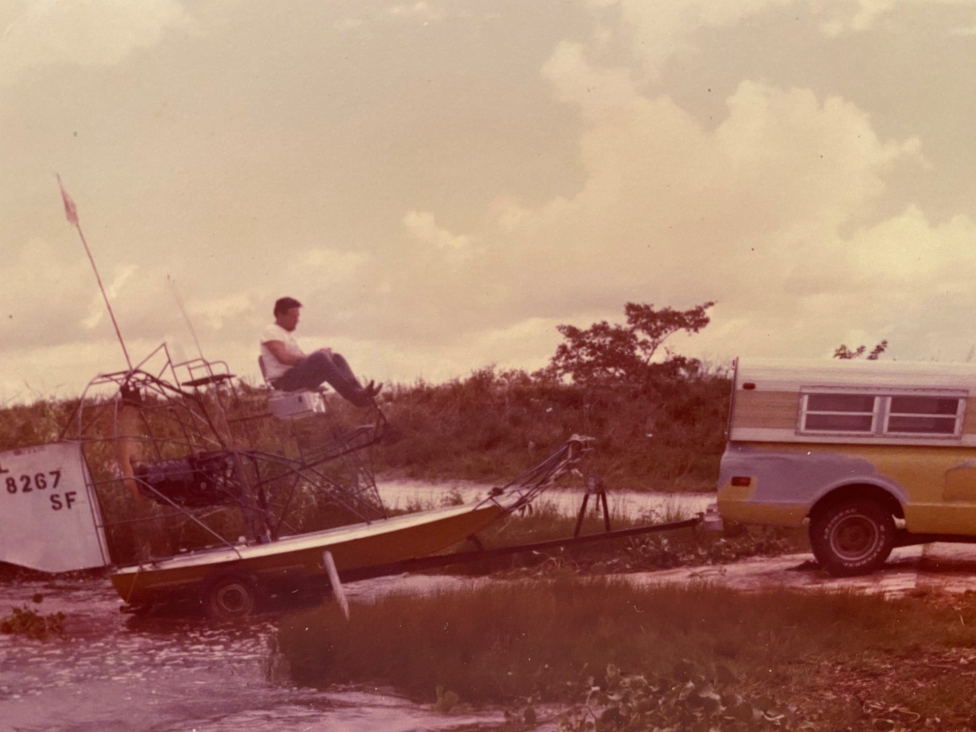 Bobby loading yellow airboat on the trailer