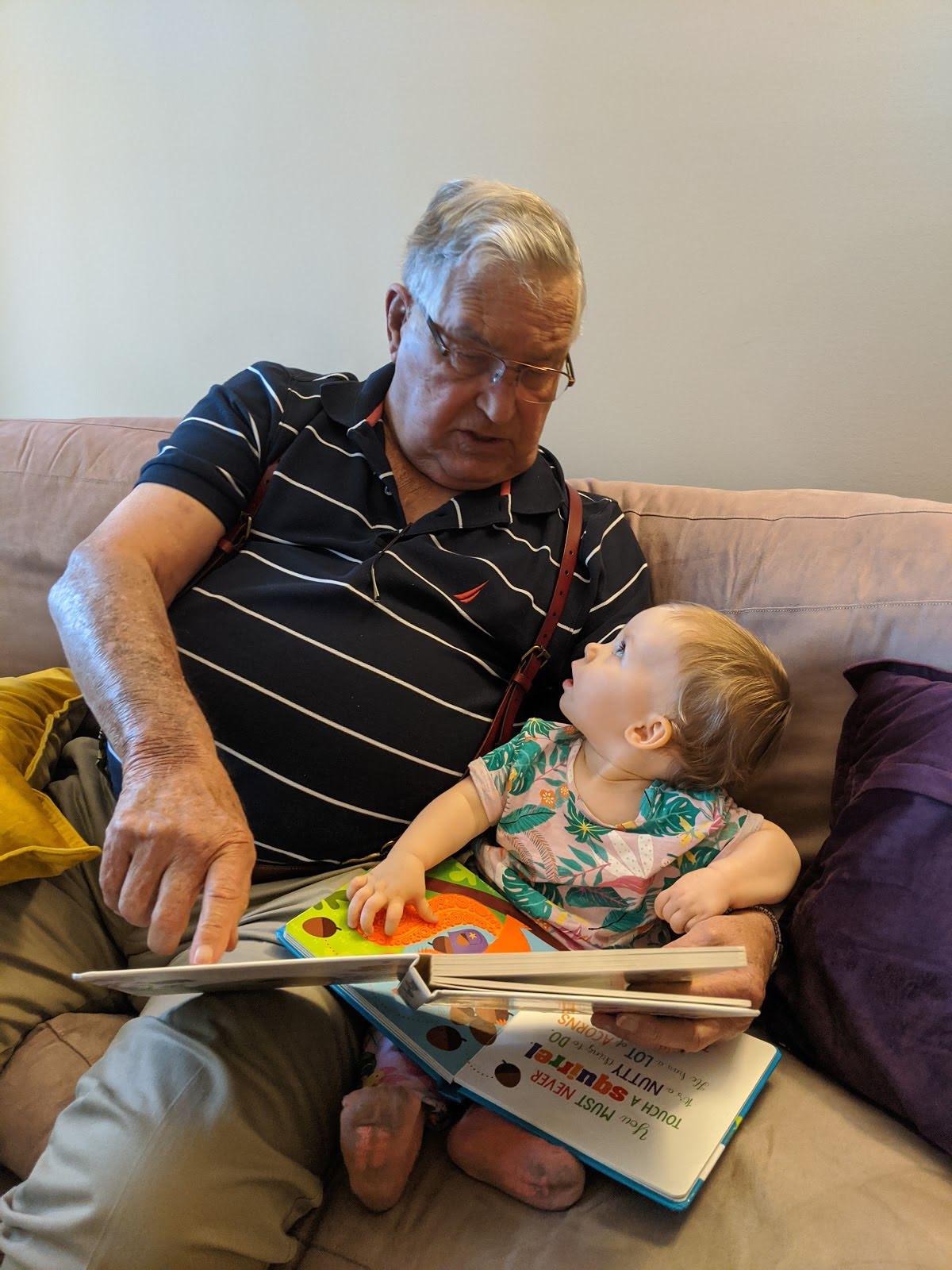 Dad (Pap Chuck) reading to Maeve his great granddaughter. <br />
Barbara