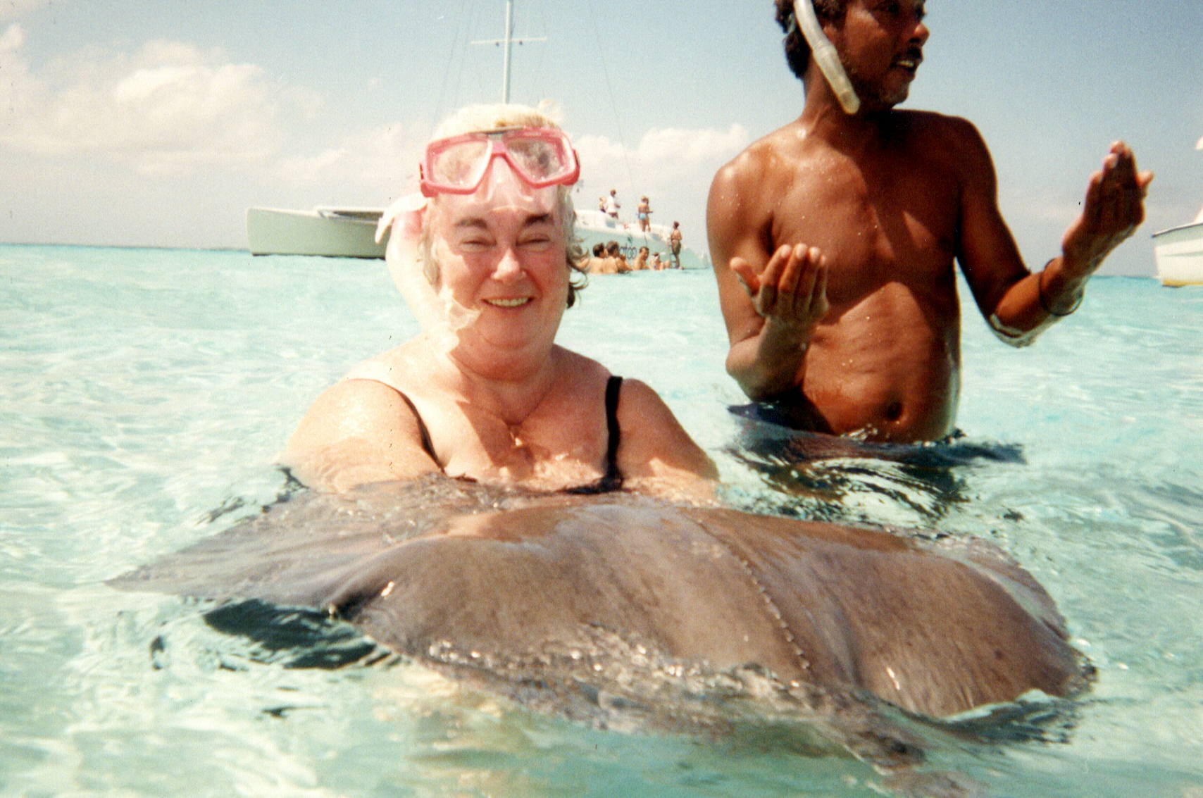 Mom at Cayman Island vacation - petting a stingray