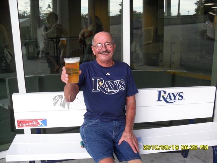 All smiles with baseball and beer 