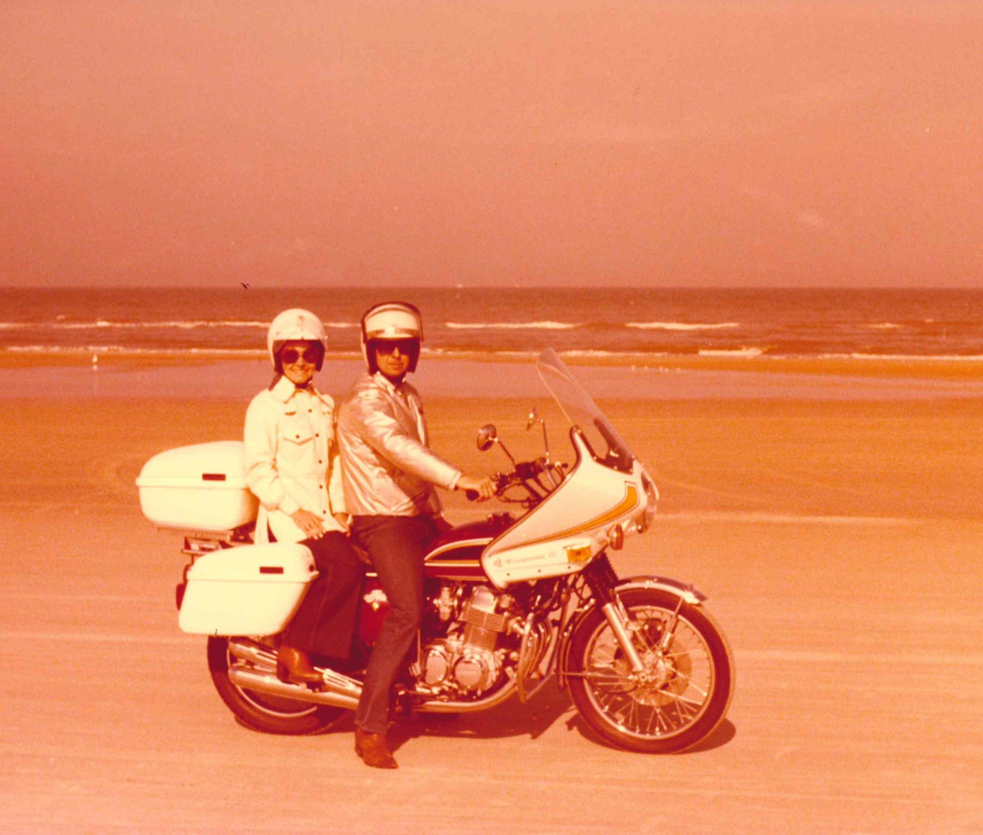 George and Elaine riding together on the beach
