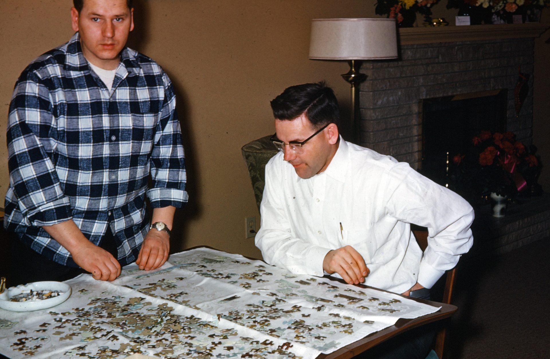 Brothers; Bob and David putting together a puzzle at "Grandma's house".