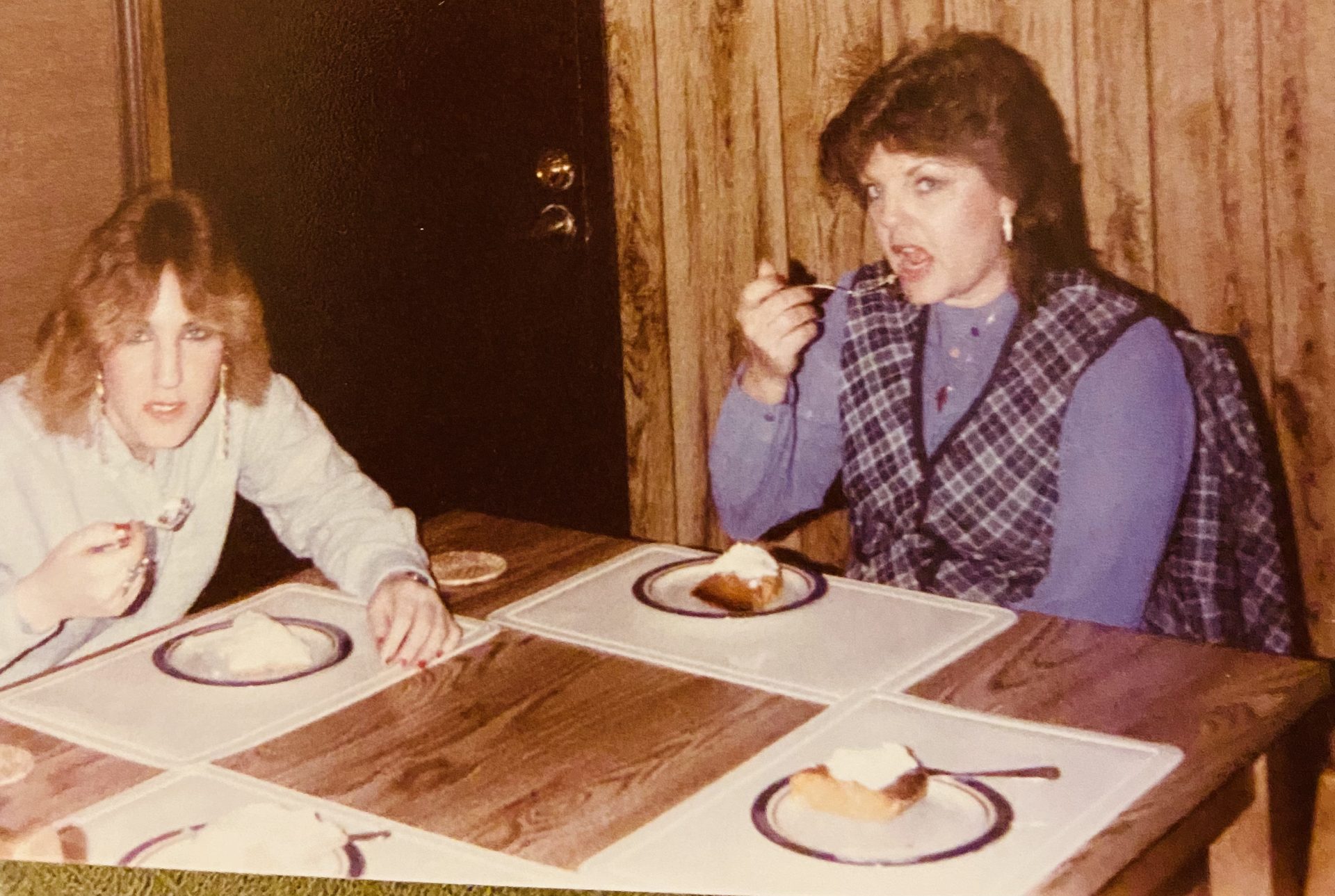 Tina and mom eating pumpkin pie for Christmas 1986
