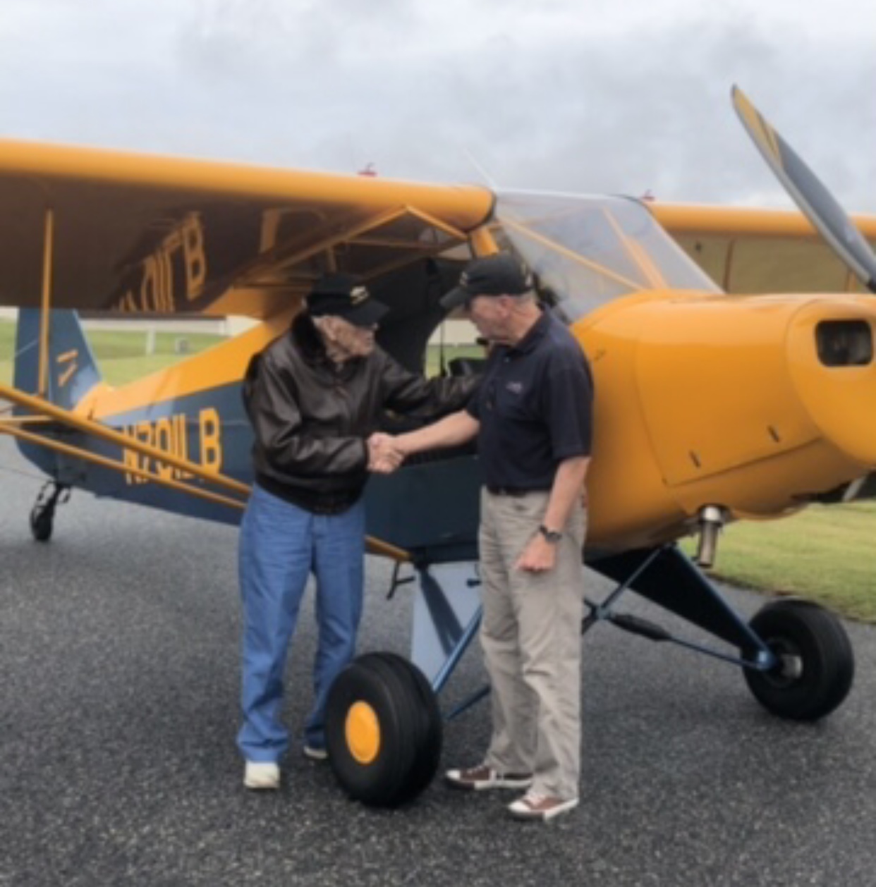 Hank shaking hands with Bobby Blankenship (owner & Pilot) who took Hank for his 100th Birthday flight and 3 landings at Love’s Landing Aviation Community