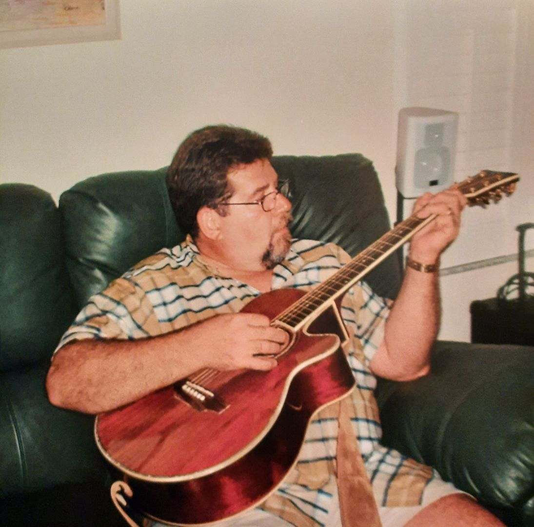 Dad playing 1 of his many awesome guitars