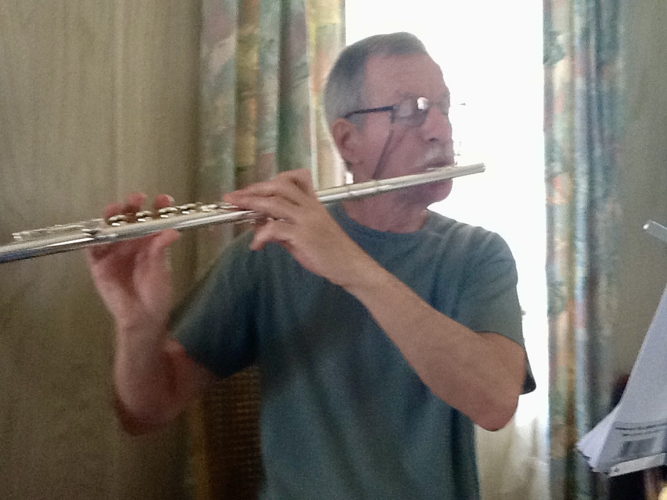 Practicing his flute