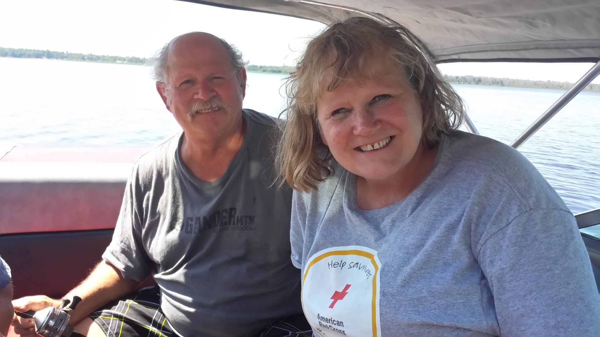 Diane and Don on our boat enjoying a sunny day on Lake St. Helen