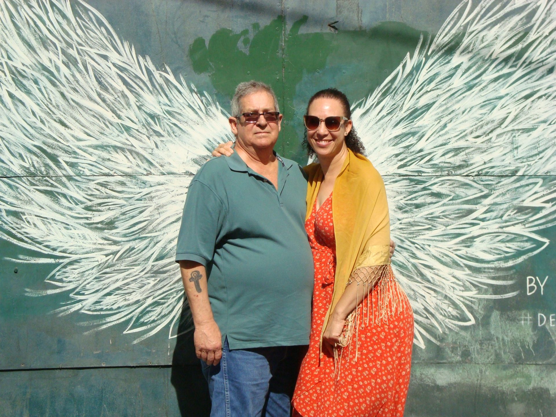 Picture of Roger and Sheeah at the wall with Angel Wings