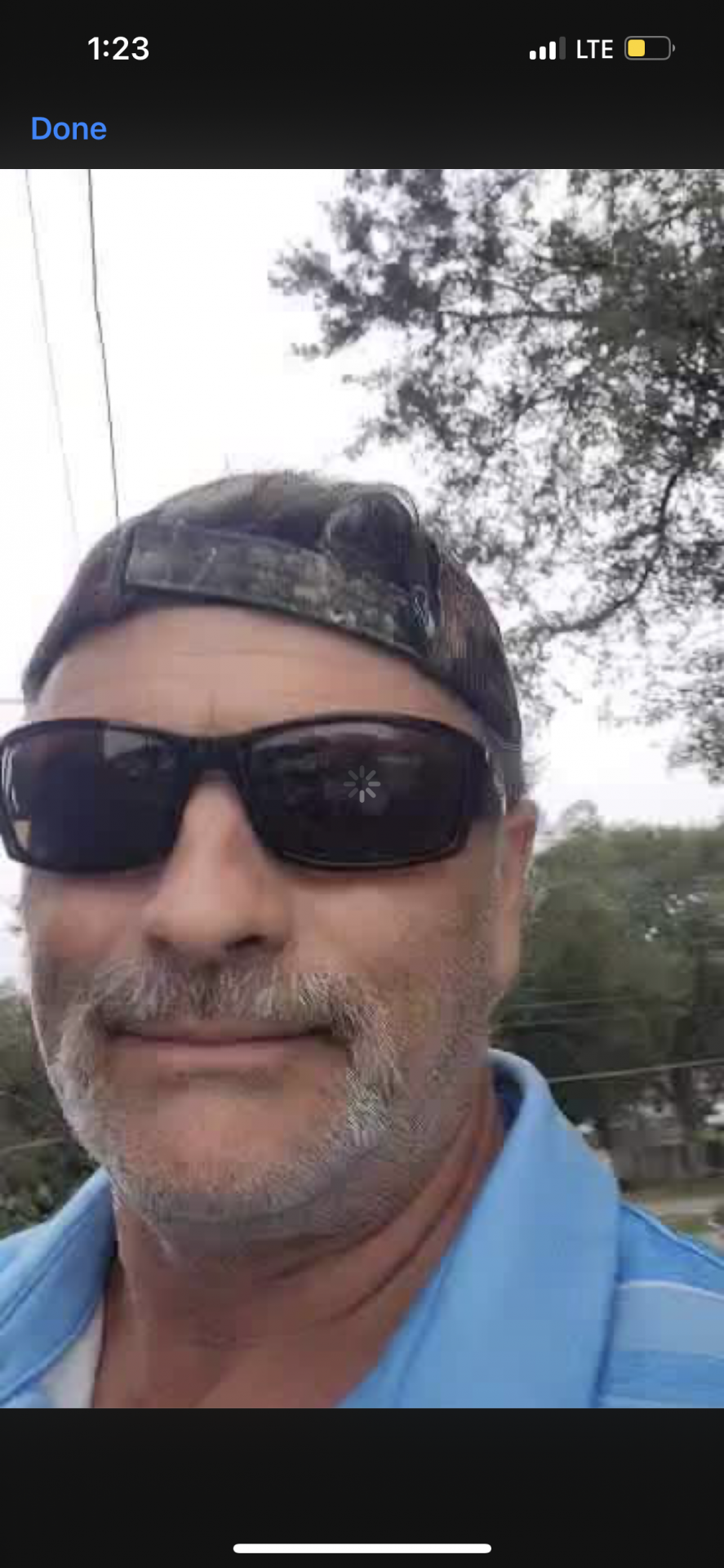 Screenshot from The very last video he sent to me ; he’s on a telephone pole making cable connections , he was so funny