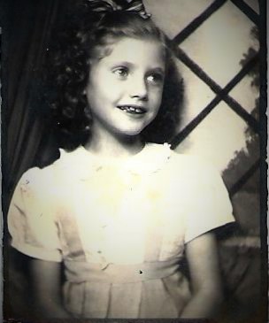 Anyone what to guess how old she was here and the year? She sure was cute!