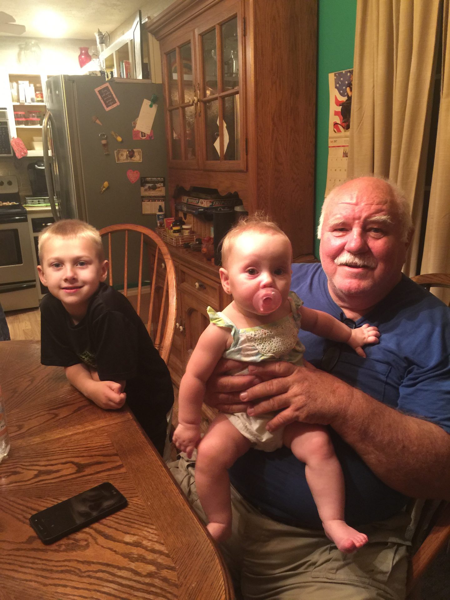 Grandpa with his two of his great grandchildren.