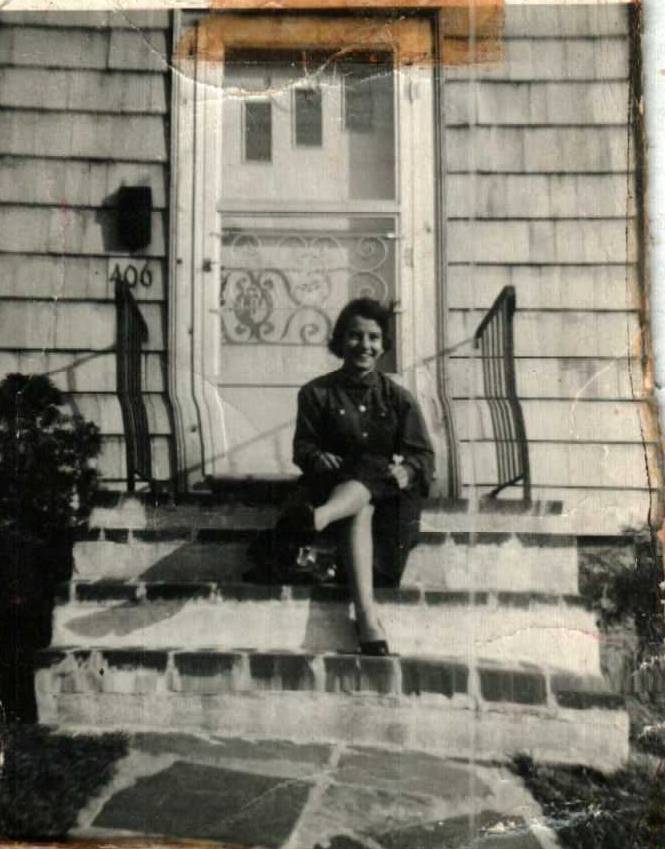 Betty sitting on the steps at 406 Montello