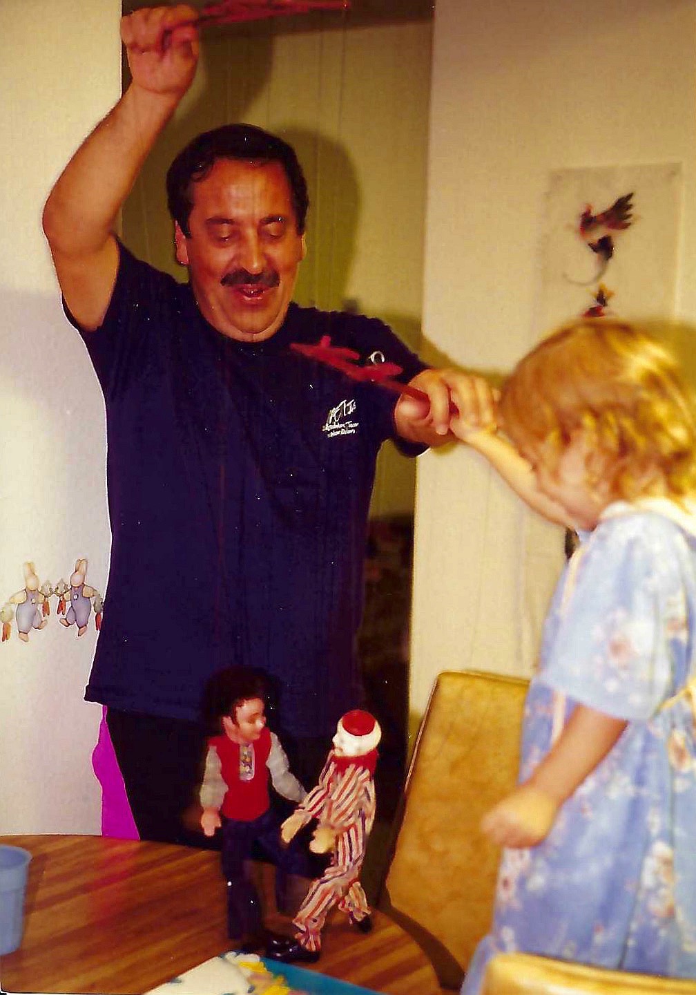 Nikki , grandpa ("Jimmy") and more puppeteering teaching her the family trade secrets with his childhood marionettes.