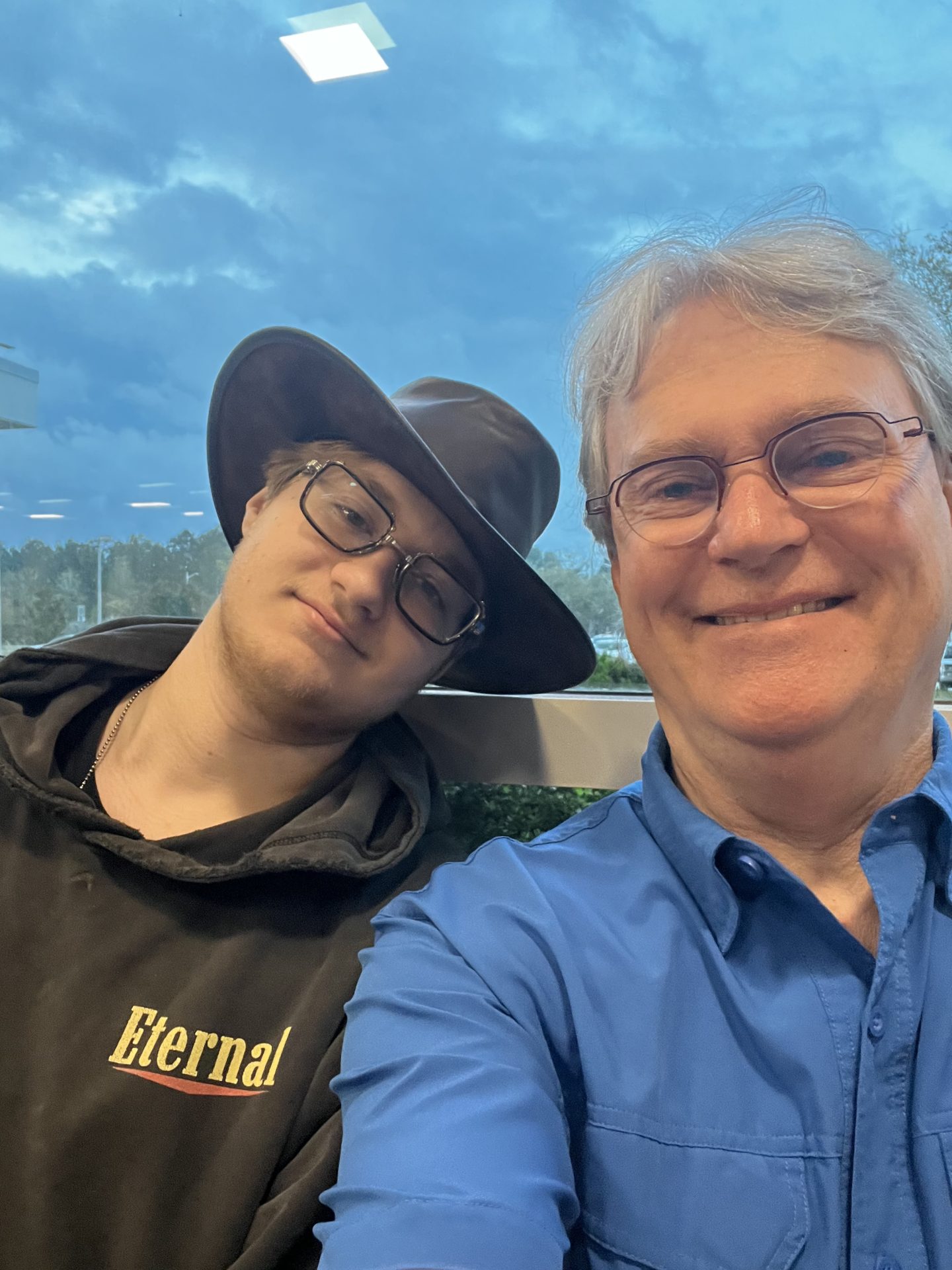 Luke & Dad waiting at the airport for Luke to leave (for the first time every away from Dad) to start his adventure at Job Corps.