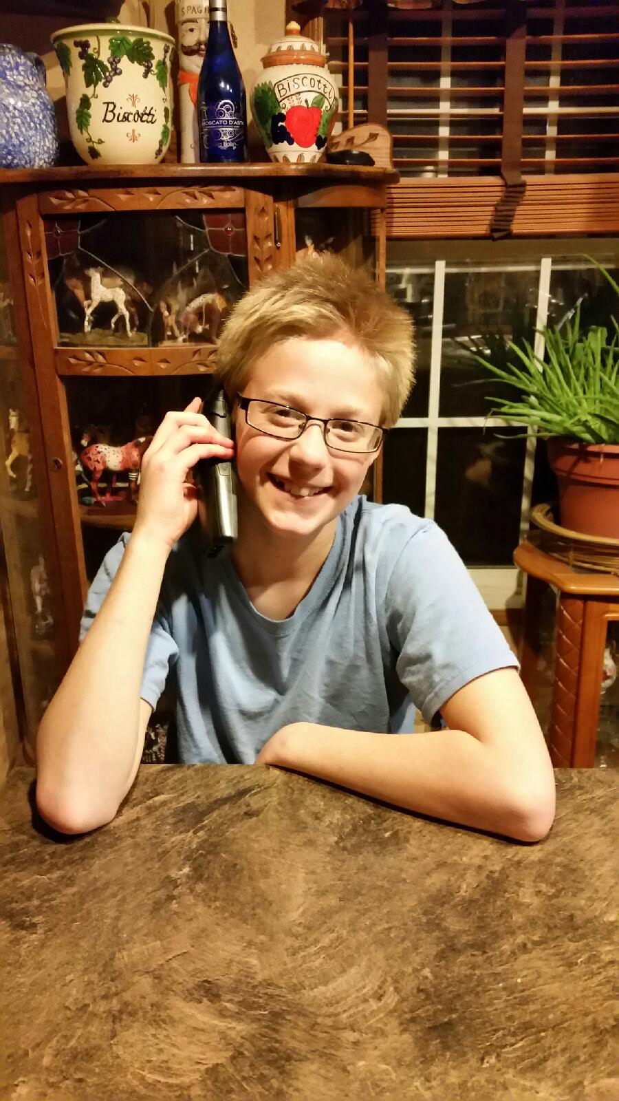 This is a great photo and one of my favorites.  Luke is still in his foster home in Arkansas, and is talking with me on the telephone.  Look at his joy!
