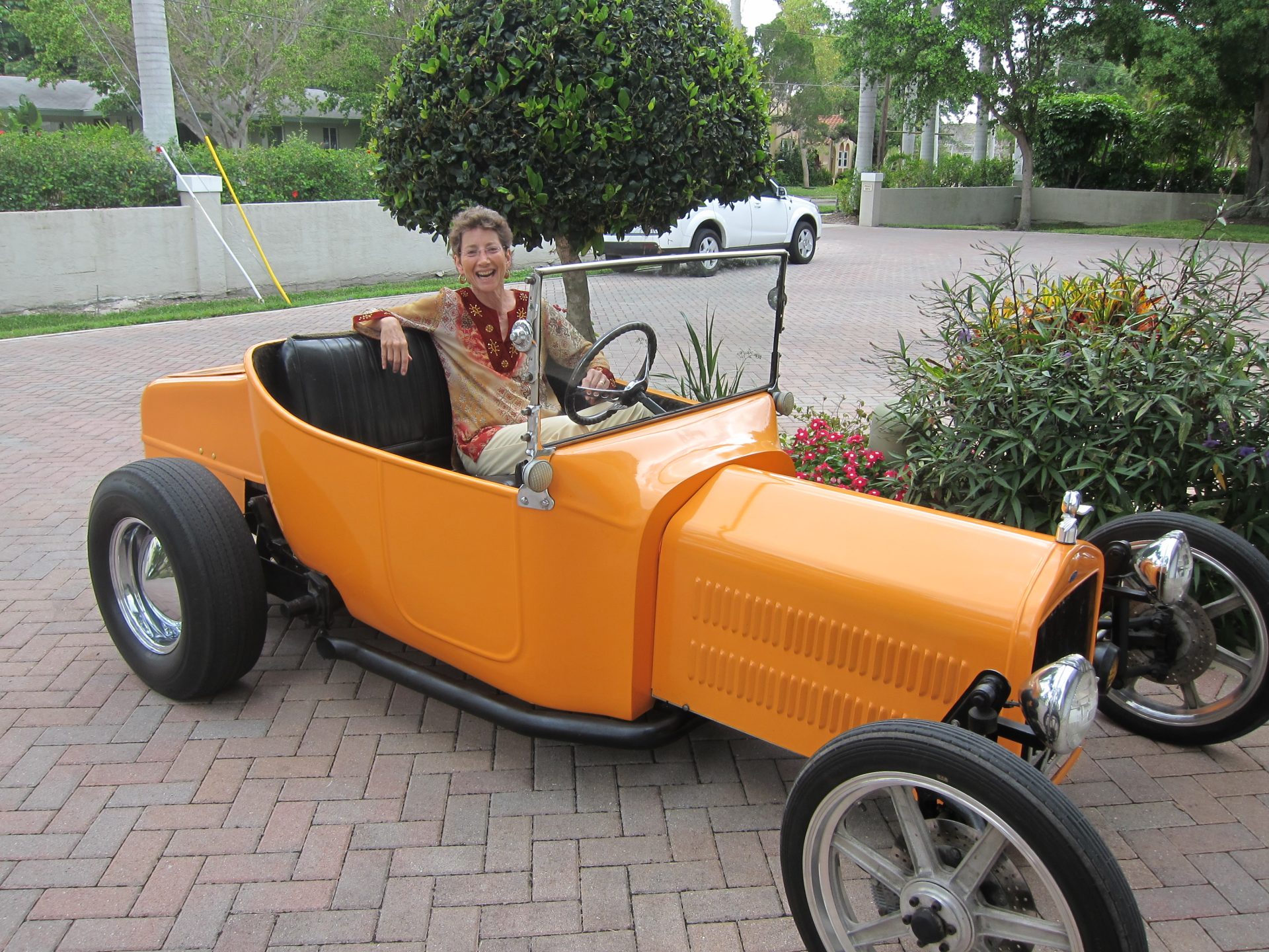 Jane in one of Pat's Roadsters . We miss you, a talented and loving man.