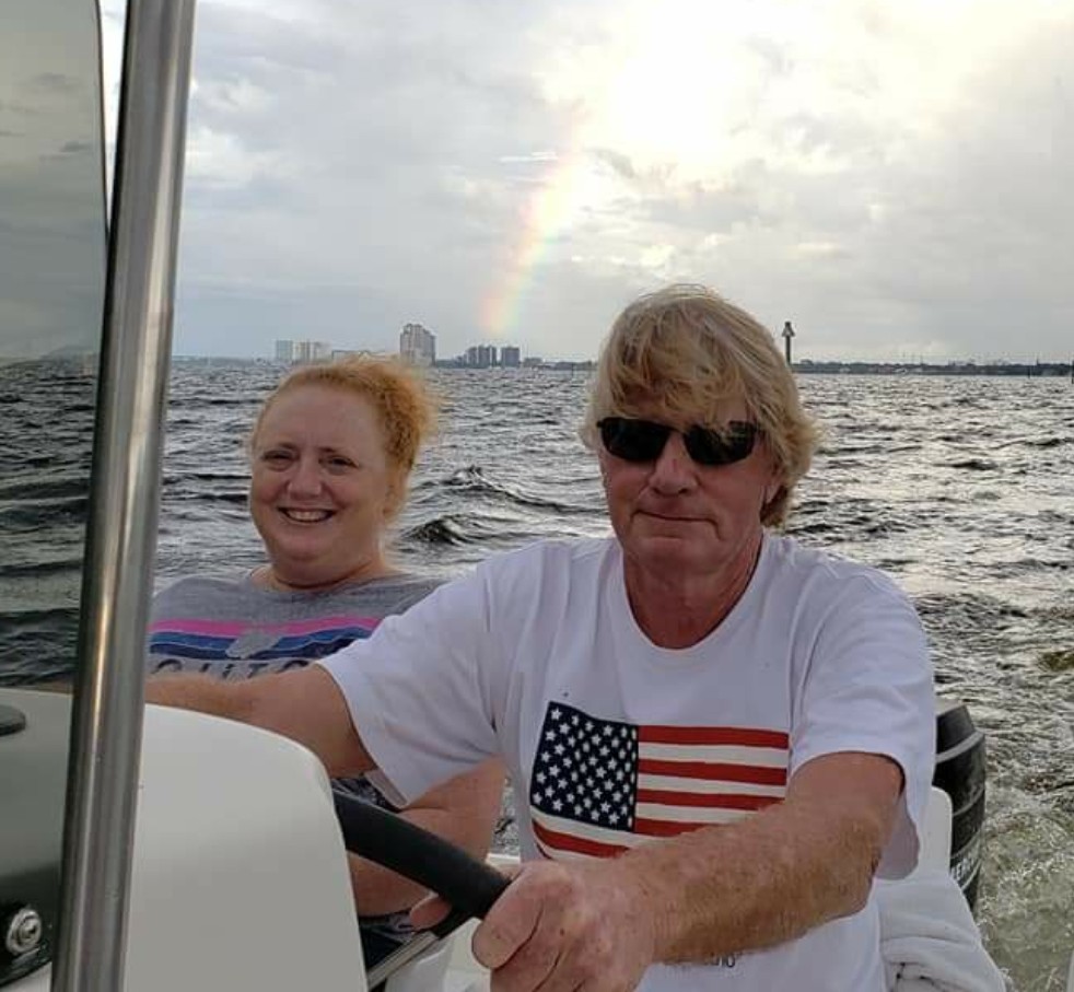 I love this pic of Roger and I on the boat with a rainbow over us.