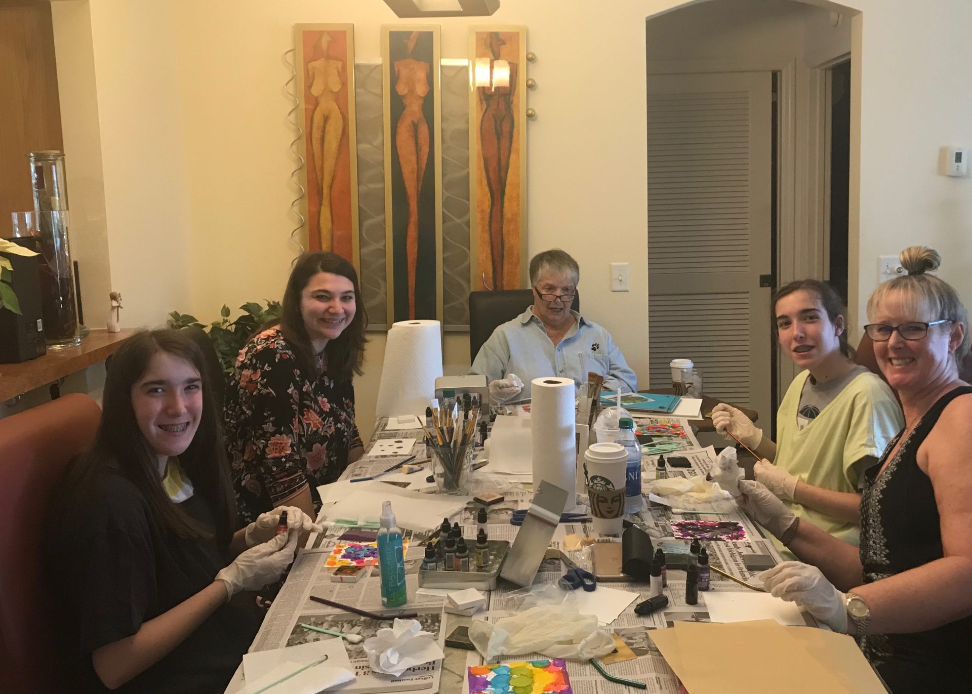 Teaching her girls new painting styles