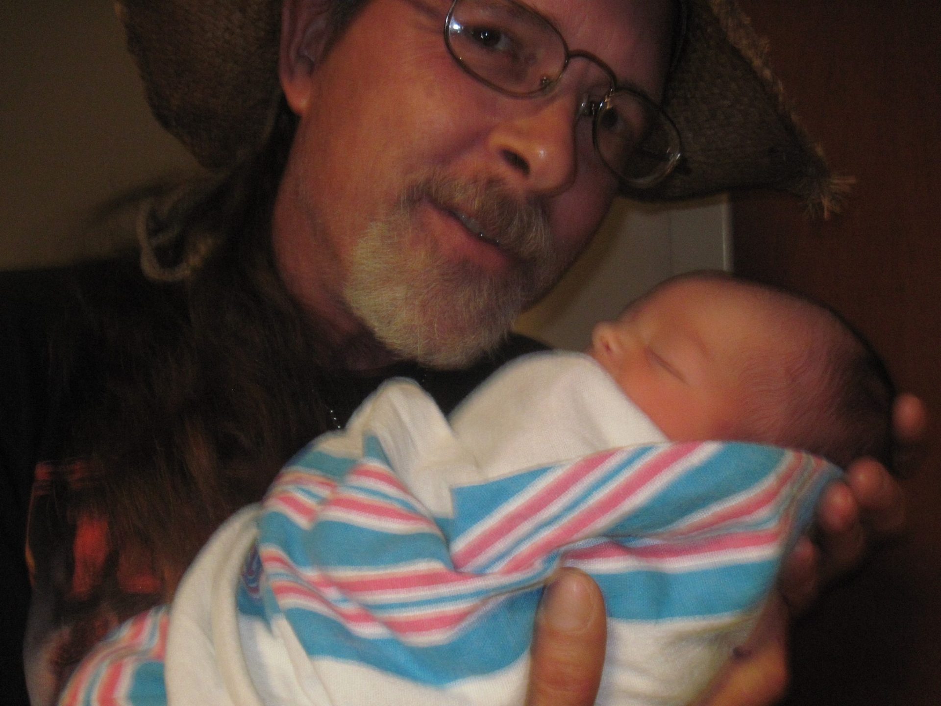 Troy was so proud of his son and his little grand babies Rylee and Aiden. He is holding one of them here in this picture he sent me